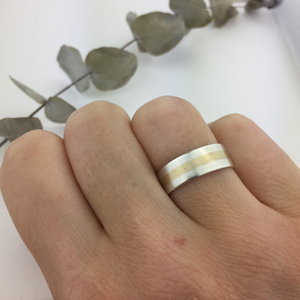 Silver and yellow gold stripe ring.