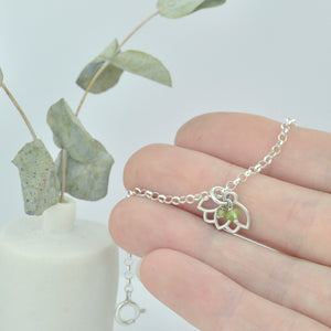 Peridot August Birthstone sterling silver bracelet with Lotus petal charm.
