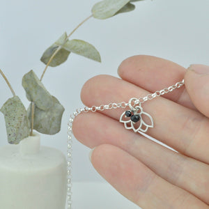 Black Spinel August Birthstone sterling silver bracelet with Lotus petal charm.