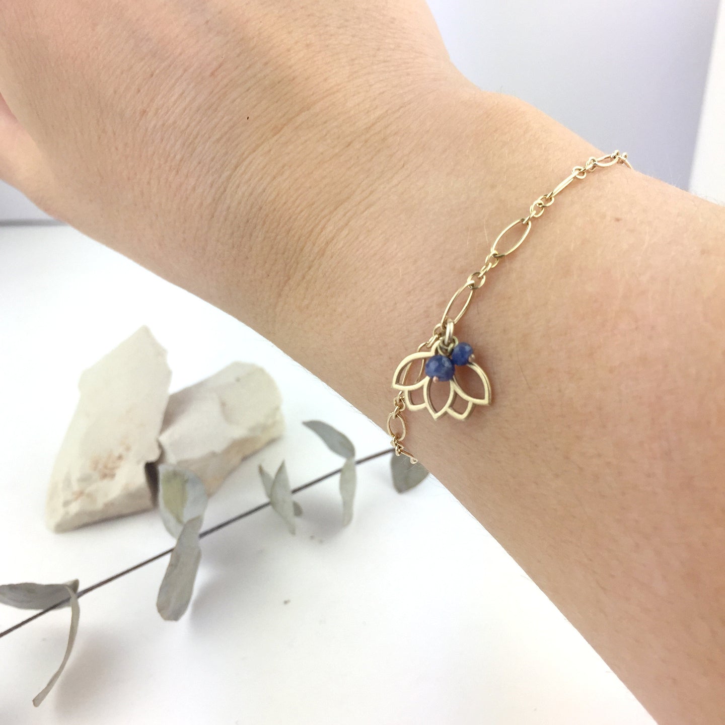 9ct Yellow Gold Blue sapphire Lotus charm on bracelet, September Birthstone.
