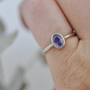 14kt white gold oval Purple Sapphire bezel set ring